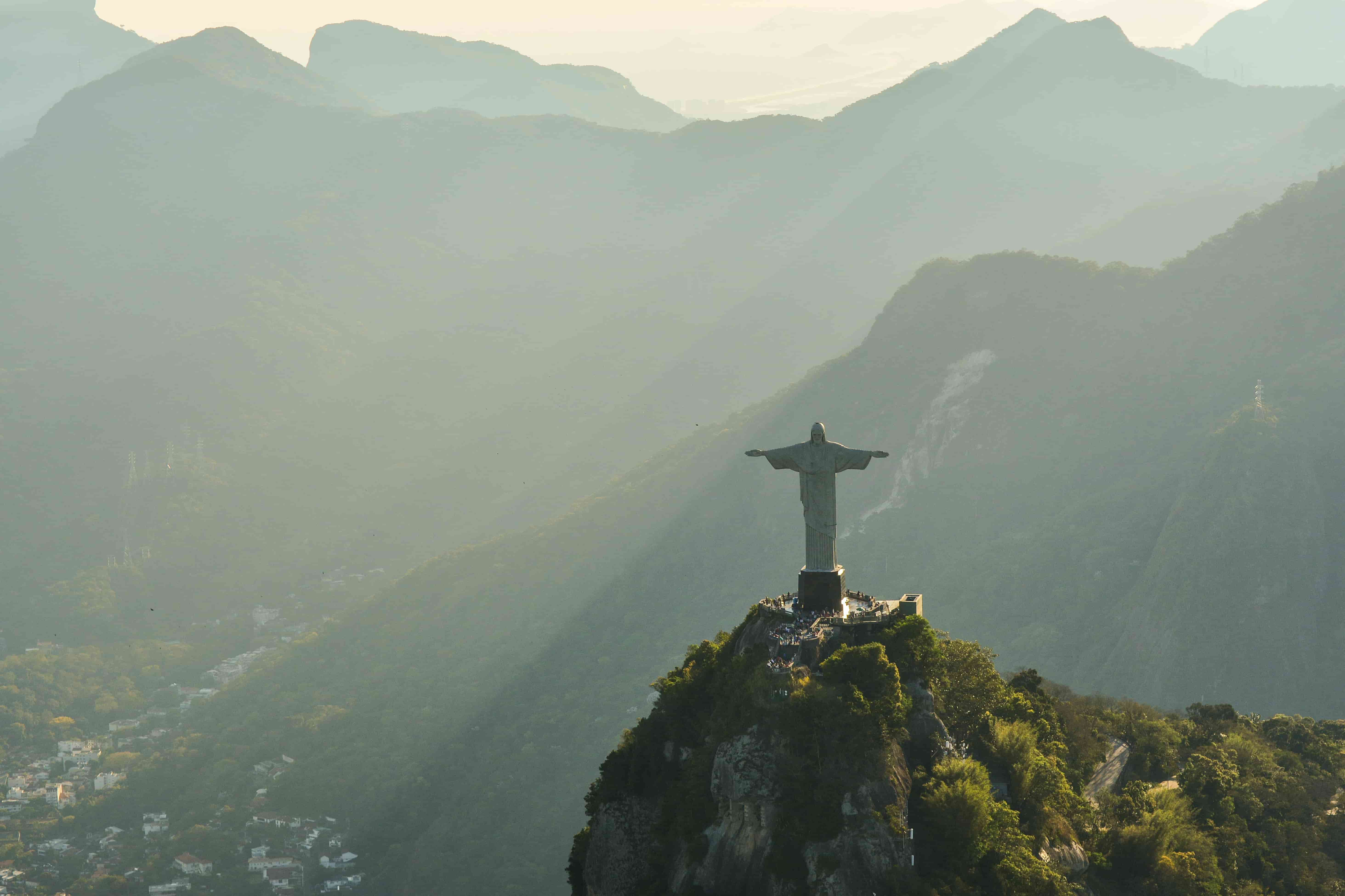 Christ the Redeemer statue in Rio de Janeiro, Brazil at sunset.